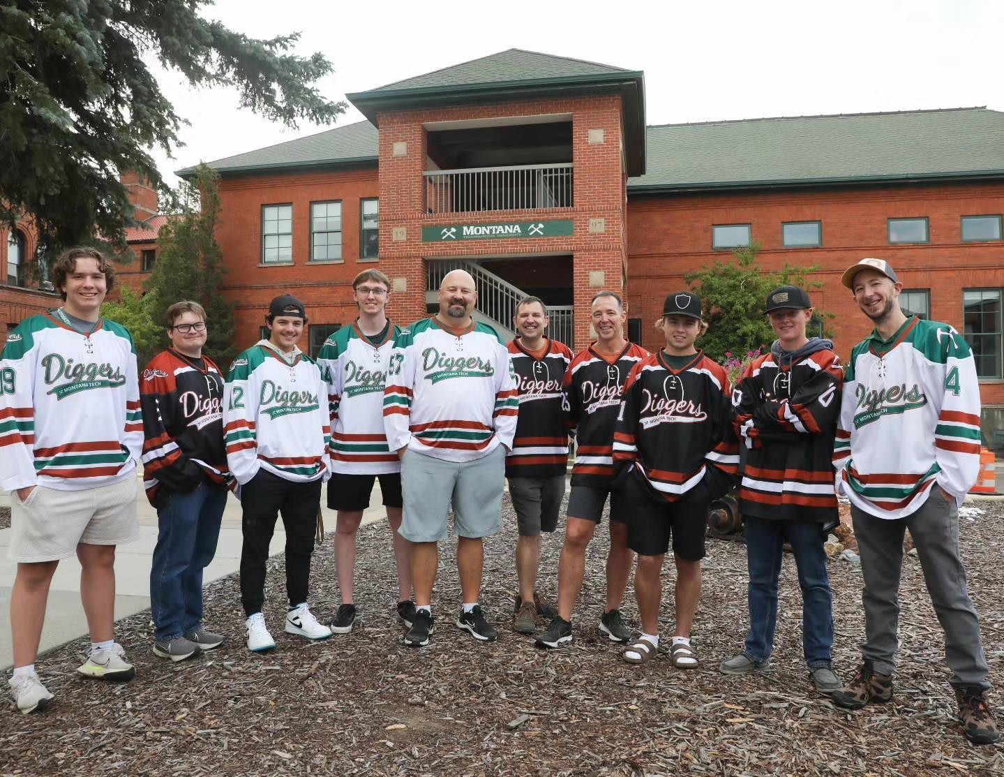Members of the Tech team pose with Montana Tech Admin