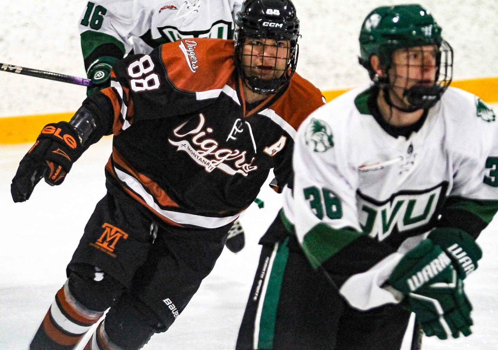  Montana Tech’s Mike McKay would have a goal in the first game and is shown here working against a UVU skater.  